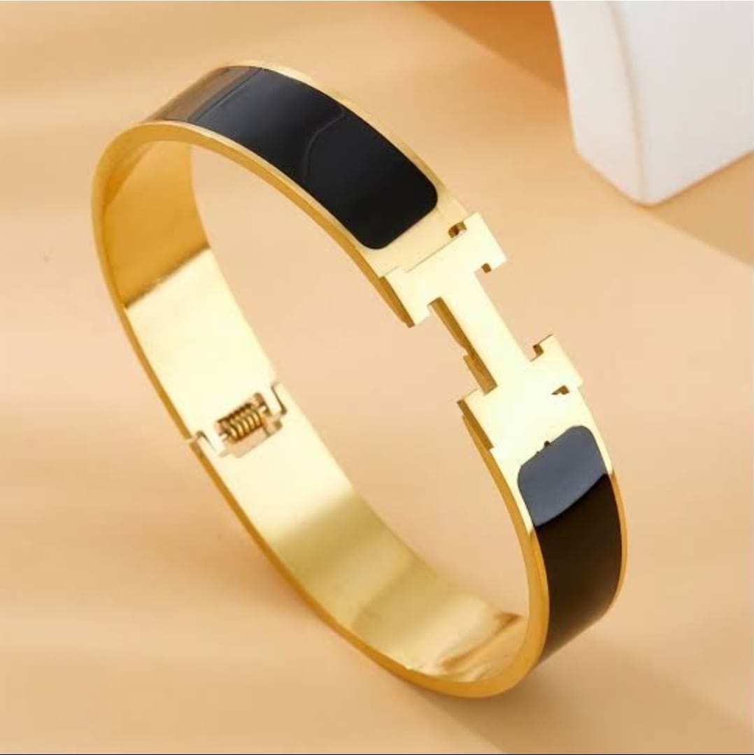 Hermes black and gold click bracelet